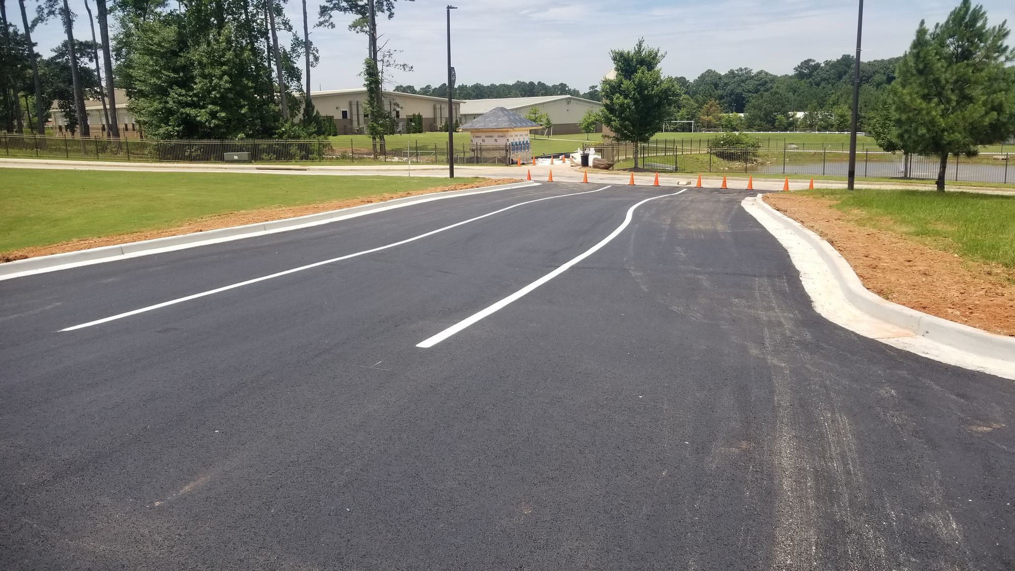 Widening asphalt road at Hebron Christian Academy helps kids get to school safely